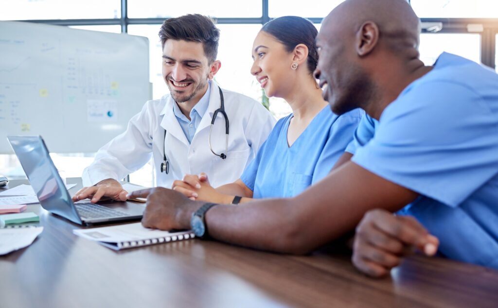 Doctors, teamwork or research on laptop for health, medicine or healthcare innovation planning, col