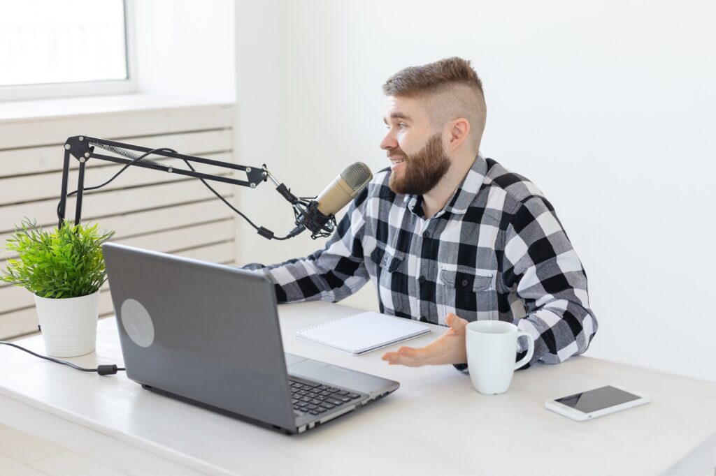 Media and entertainment: Streamer, blogger and media concept - radio dj working at studio