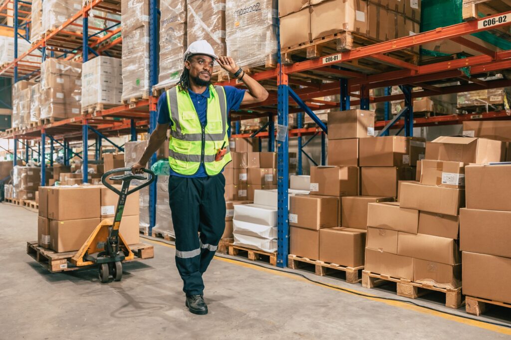 Supply Chain Logistics: warehouse worker using parcel pallet in cargo shipping logistics ship supply management